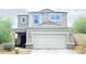 Attractive two-story home featuring desert landscaping and a two-car garage at 3402 N 300Th Dr, Buckeye, AZ 85396