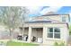 Exterior of home featuring solar panels and covered patio with grills at 3402 N 300Th Dr, Buckeye, AZ 85396