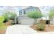 Charming two-story home featuring desert landscaping and a two-car garage at 3402 N 300Th Dr, Buckeye, AZ 85396