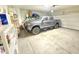 Well-lit garage featuring a gray truck and abundant storage solutions at 3402 N 300Th Dr, Buckeye, AZ 85396