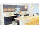 Detailed kitchen view with granite countertops and stainless steel microwave at 3402 N 300Th Dr, Buckeye, AZ 85396