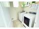 Functional laundry room with a modern washer and dryer, and ample storage space at 3402 N 300Th Dr, Buckeye, AZ 85396