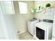 Well-organized laundry room with modern Samsung washer and dryer and plenty of storage space on shelving at 3402 N 300Th Dr, Buckeye, AZ 85396