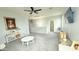 Spacious living room with large windows, neutral walls, and modern decor at 3402 N 300Th Dr, Buckeye, AZ 85396