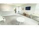 Spacious living room with lots of natural light, gray walls, light carpet, and entertainment center at 3402 N 300Th Dr, Buckeye, AZ 85396