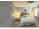 Warm main bedroom features a cozy bed, soft lighting, and light-colored decor at 3402 N 300Th Dr, Buckeye, AZ 85396
