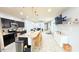 Bright open-concept showcases kitchen island with seating flowing into the comfortable living area at 3402 N 300Th Dr, Buckeye, AZ 85396