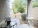 Cozy patio space with outdoor seating and views of the landscaped front yard at 3402 N 300Th Dr, Buckeye, AZ 85396