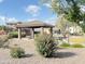 Outdoor community picnic area with gazebo and flowering shrubs for residents at 3402 N 300Th Dr, Buckeye, AZ 85396