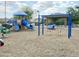 Community playground with swings, spring rider and climbing providing recreational space for children at 3402 N 300Th Dr, Buckeye, AZ 85396