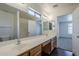 Bright bathroom with a double sink vanity and a large mirror at 3405 W La Salle St, Phoenix, AZ 85041
