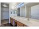 Bathroom featuring double sink vanity and large mirror at 3405 W La Salle St, Phoenix, AZ 85041