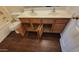 Bathroom featuring double sinks, wood-look flooring, and warm cabinetry for ample storage space at 3405 W La Salle St, Phoenix, AZ 85041