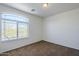 Carpeted bedroom with a large window at 3405 W La Salle St, Phoenix, AZ 85041