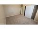 Cozy bedroom with neutral carpet, closet, and natural light at 3405 W La Salle St, Phoenix, AZ 85041