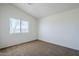 Bedroom featuring neutral carpet, bright walls and a window with blinds at 3405 W La Salle St, Phoenix, AZ 85041