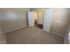 Bedroom with carpet flooring, neutral walls, and an adjoining bathroom for added privacy at 3405 W La Salle St, Phoenix, AZ 85041