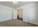 Bedroom showcasing an ensuite bathroom accessible through elegant double doors at 3405 W La Salle St, Phoenix, AZ 85041