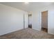 Neutral carpeted bedroom with bright walls, and a walk in closet at 3405 W La Salle St, Phoenix, AZ 85041