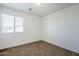 Bedroom featuring neutral carpet, bright walls and a window at 3405 W La Salle St, Phoenix, AZ 85041