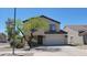 Charming two-story home with a well-manicured front yard and attached two-car garage at 3405 W La Salle St, Phoenix, AZ 85041