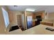 Functional kitchen with stainless steel appliances, light wood cabinets, and pantry at 3405 W La Salle St, Phoenix, AZ 85041