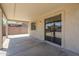 Spacious covered patio featuring concrete flooring and slider door access to the home at 3405 W La Salle St, Phoenix, AZ 85041