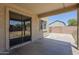 Covered patio featuring concrete flooring, slider door and views of the backyard at 3405 W La Salle St, Phoenix, AZ 85041