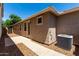 Exterior side of house with AC unit and decorative rocks at 3477 E Sheffield Rd, Gilbert, AZ 85296
