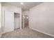 Neutral carpeted bedroom with closet and entry to hallway and another bedroom at 3477 E Sheffield Rd, Gilbert, AZ 85296