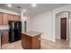 Bright kitchen featuring stainless steel appliances, granite counters, and an island for food preparation and entertaining at 3477 E Sheffield Rd, Gilbert, AZ 85296