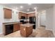 Cozy kitchen featuring granite countertops, black appliances and center island for added convenience at 3477 E Sheffield Rd, Gilbert, AZ 85296