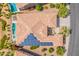 Aerial view of home featuring a pool, spa, patio seating and solar panels at 36298 N Crucillo Dr, Queen Creek, AZ 85140