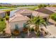 An aerial view showing the house with a view of the lush golf course and green landscaping at 36298 N Crucillo Dr, Queen Creek, AZ 85140