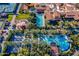 Stunning aerial shot of a community showcasing multiple pools, tennis courts, and lush landscaping at 36298 N Crucillo Dr, Queen Creek, AZ 85140