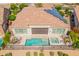 Aerial view of home featuring a pool, spa, patio seating, a covered patio and solar panels at 36298 N Crucillo Dr, Queen Creek, AZ 85140