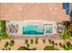 Bird's eye view of backyard pool, hot tub, outdoor kitchen, landscaping and patio seating at 36298 N Crucillo Dr, Queen Creek, AZ 85140