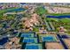 Breathtaking aerial view of a luxurious community featuring golf courses, tennis courts, and a grand clubhouse at 36298 N Crucillo Dr, Queen Creek, AZ 85140