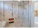 Spa-like bathroom showcasing a frameless walk-in shower and storage niche with decorative elements at 36298 N Crucillo Dr, Queen Creek, AZ 85140