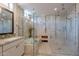 Luxurious bathroom with a soaking tub, walk-in shower, and stylish marble tile work at 36298 N Crucillo Dr, Queen Creek, AZ 85140