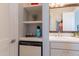Bathroom nook with shelving, beverage cooler, coffee maker, and accent lighting at 36298 N Crucillo Dr, Queen Creek, AZ 85140