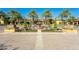 Beautiful entrance of the community featuring landscaping, pavers, flowers, and fountains at 36298 N Crucillo Dr, Queen Creek, AZ 85140