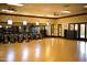 Bright fitness center with multiple exercise bikes, full mirror wall, and a spacious floor plan at 36298 N Crucillo Dr, Queen Creek, AZ 85140