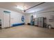 Spacious and organized garage offering plenty of room for storage and parking with epoxy floors at 36298 N Crucillo Dr, Queen Creek, AZ 85140