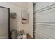 This garage area features a water heater, utility controls, storage tanks, and a large garage door at 36298 N Crucillo Dr, Queen Creek, AZ 85140