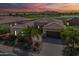Beautiful single-Gathering home boasting a tile roof, desert landscaping, and a picturesque golf course backdrop at 36298 N Crucillo Dr, Queen Creek, AZ 85140