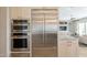 Kitchen features stainless steel refrigerator, double oven, and microwave at 36298 N Crucillo Dr, Queen Creek, AZ 85140