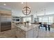 Kitchen island overlooks the living and dining rooms in an open-concept layout at 36298 N Crucillo Dr, Queen Creek, AZ 85140