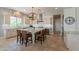 Open kitchen showcases a large island with granite countertops and seating for four at 36298 N Crucillo Dr, Queen Creek, AZ 85140