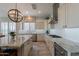 Kitchen displays granite countertops, stainless steel appliances, and white cabinets at 36298 N Crucillo Dr, Queen Creek, AZ 85140